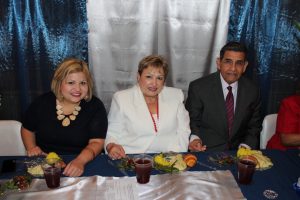 Pastor Flores and his wife and daughter enjoy the lunch which was part of the celebration of the 25th Anniversary of Pastor Flores pastorate at First Mexican Baptist Church that took place on June 14, 2015. 