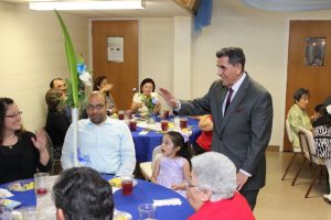 Pastor Flores greets members of the congregation at the luncheon which was part of the celebration of the 25th Anniversary of Pastor Flores pastorate at First Mexican Baptist Church that took place on June 14, 2015. 