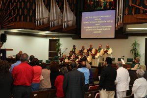 The choir and congregation sing during the Spanish language service on Easter Sunday, April 16, 2017.