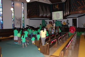 Children gathered in front of the pulpit to participate in Vacation Bible School activities on July 29, 2015.