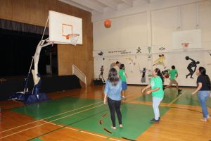 Teens play basketball in the gym at Vacation Bible School on July 30, 2015. 